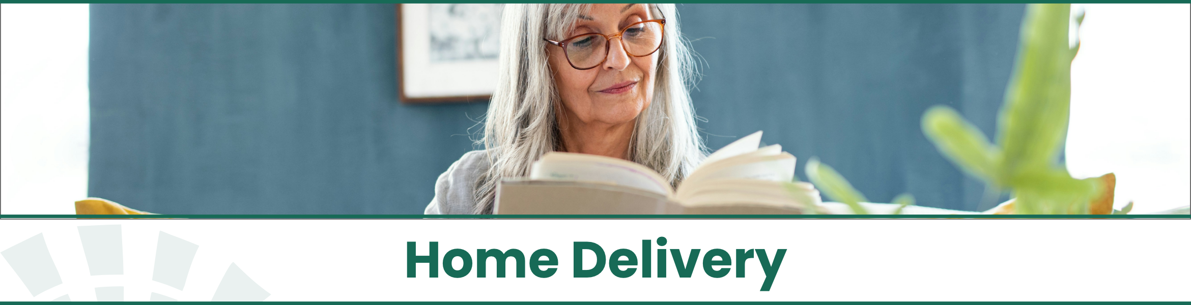 Older woman sitting at home with an open book